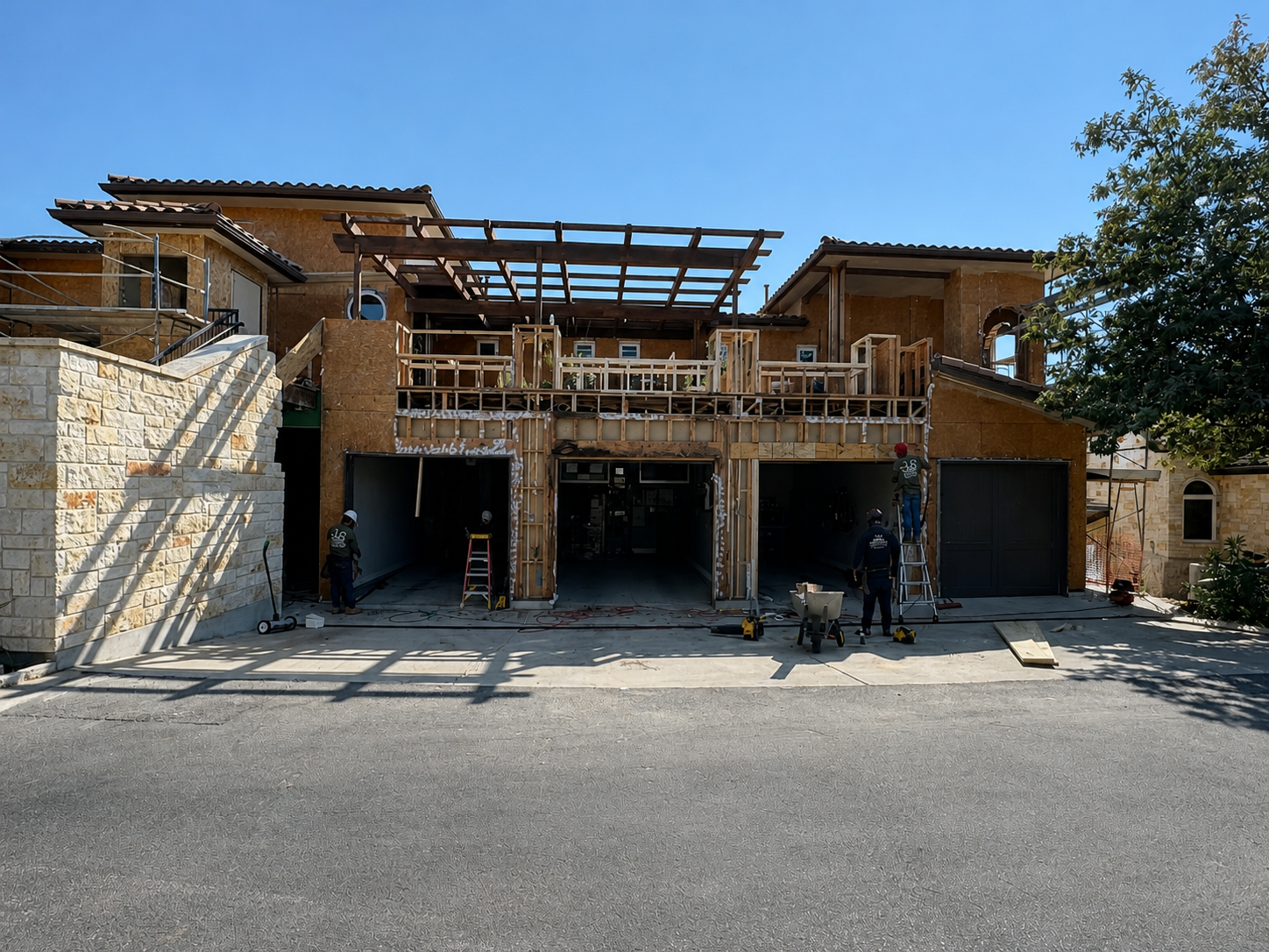Garage facade rebuilt with new wood sheathing before waterproofing